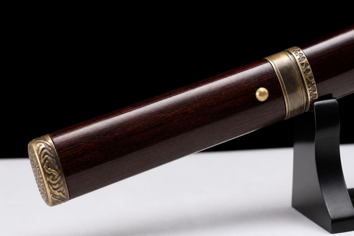 Ebony Shinogi Wakizashi — Twisted Folded T8, Carved Copper — tsuka, tsuba and menuki detail