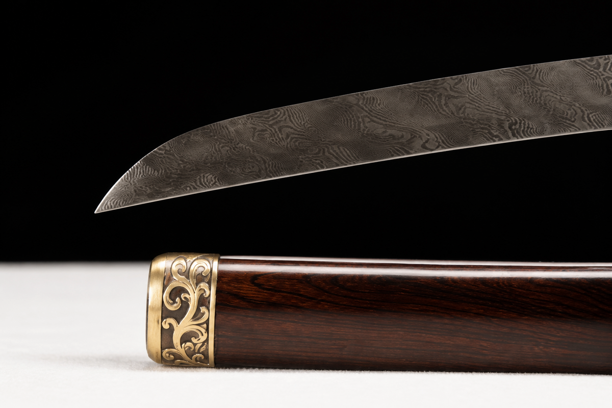 Ebony Shinogi Wakizashi — Twisted Folded T8, Carved Copper — kissaki and saya tip detail
